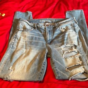 American Eagle jeans 12R worn,holes ,straight legs Strech jeans